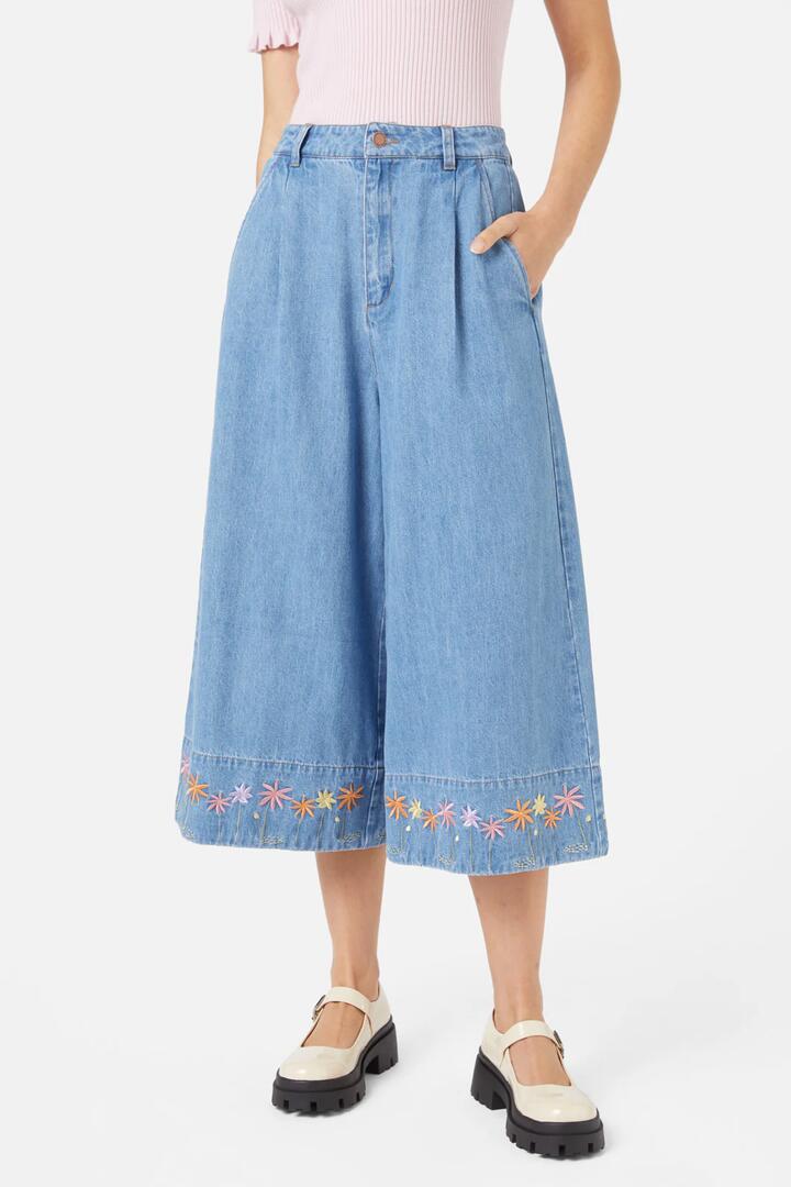 Image of a model wearing Skirts. Productname: Bloom Emb Skort in Light Denim colour by brand - Princess Highway