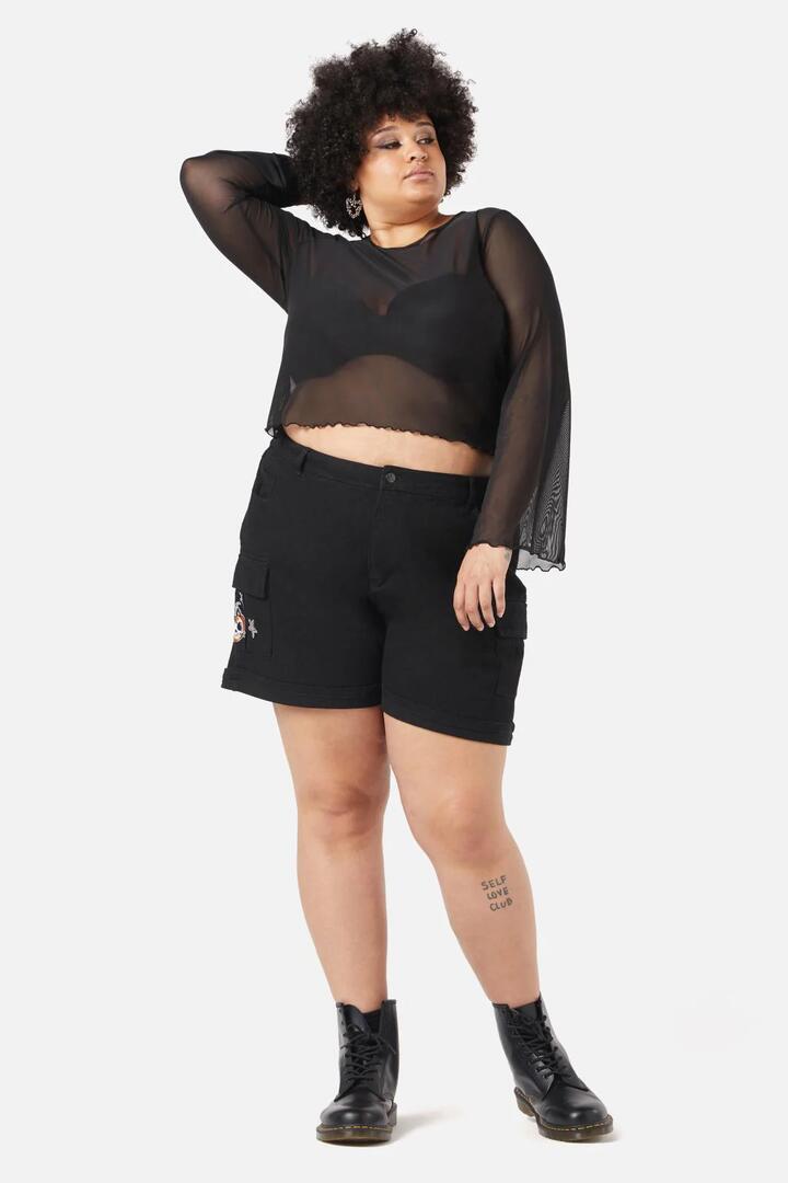 Image of a model wearing Tops. Productname: Curve Fly Away Top in Black colour by brand - Black Friday
