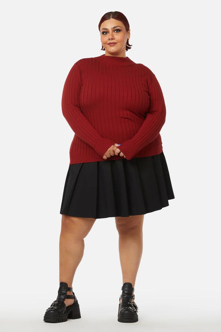 Image of a model wearing Tops. Productname: Curve Grave Respect Knit Skivvy in Red colour by brand - Dangerfield