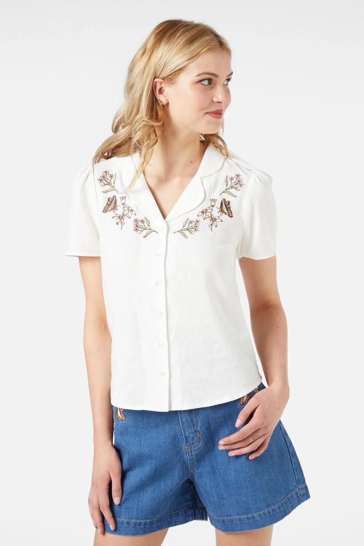 Image of a model wearing Tops. Productname: Dreams Emb Blouse in Cream colour by brand - Princess Highway