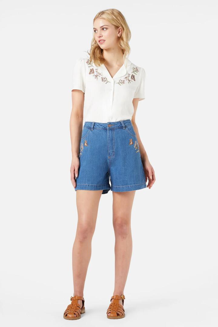 Image of a model wearing Shorts. Productname: Dreams Emb Short in Mid Denim colour by brand - Princess Highway