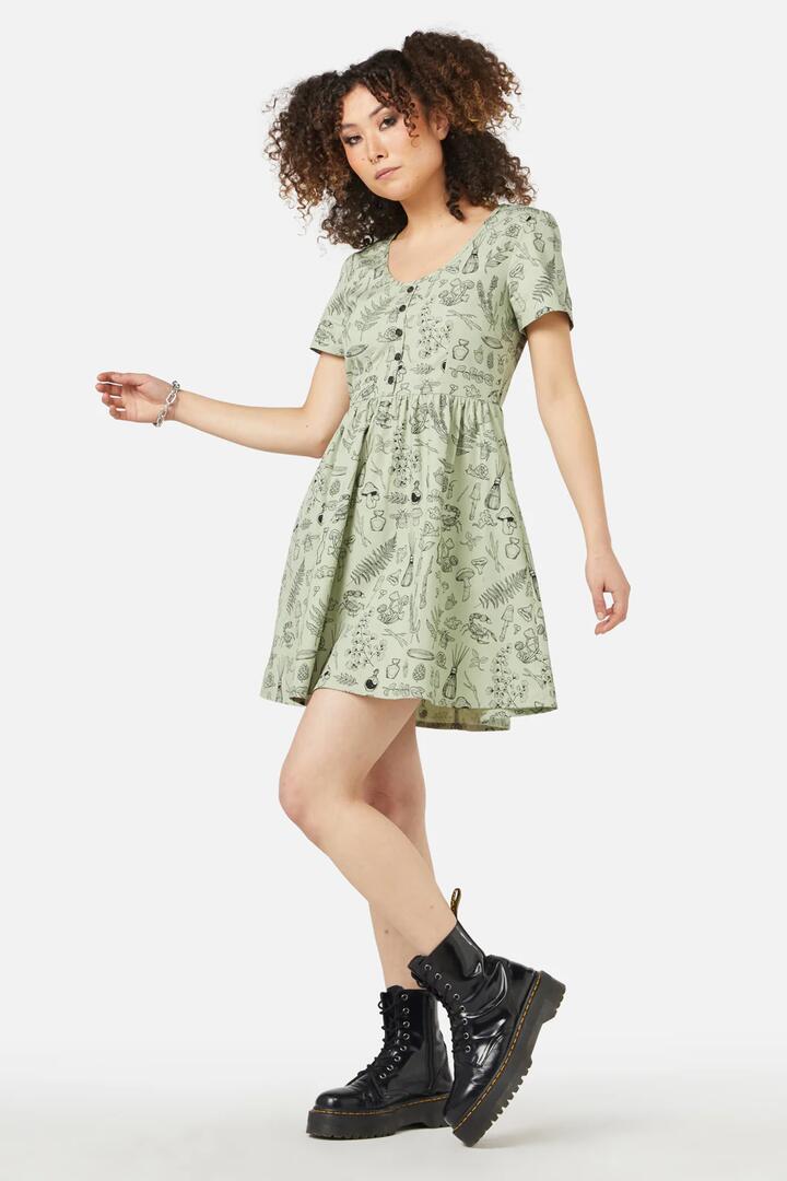 Image of a model wearing Dress. Productname: Sprouted Flora Dress in Sage colour by brand - Black Friday