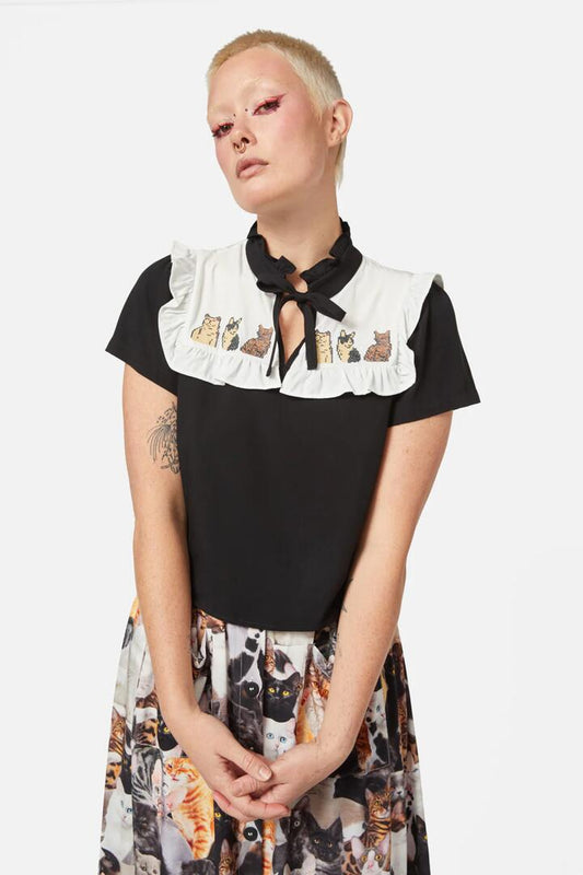 Image of a model wearing Tops. Productname: Catnip Ruffle Blouse in Black colour by brand - Dangerfield