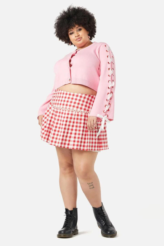 Image of a model wearing Outerwear. Productname: Curve Candy Lace Up Cardi in Pink colour by brand - Dangerfield