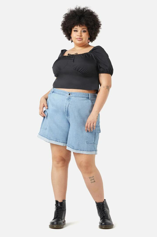 Image of a model wearing Tops. Productname: Curve Doe Bow Top in Black colour by brand - Dangerfield