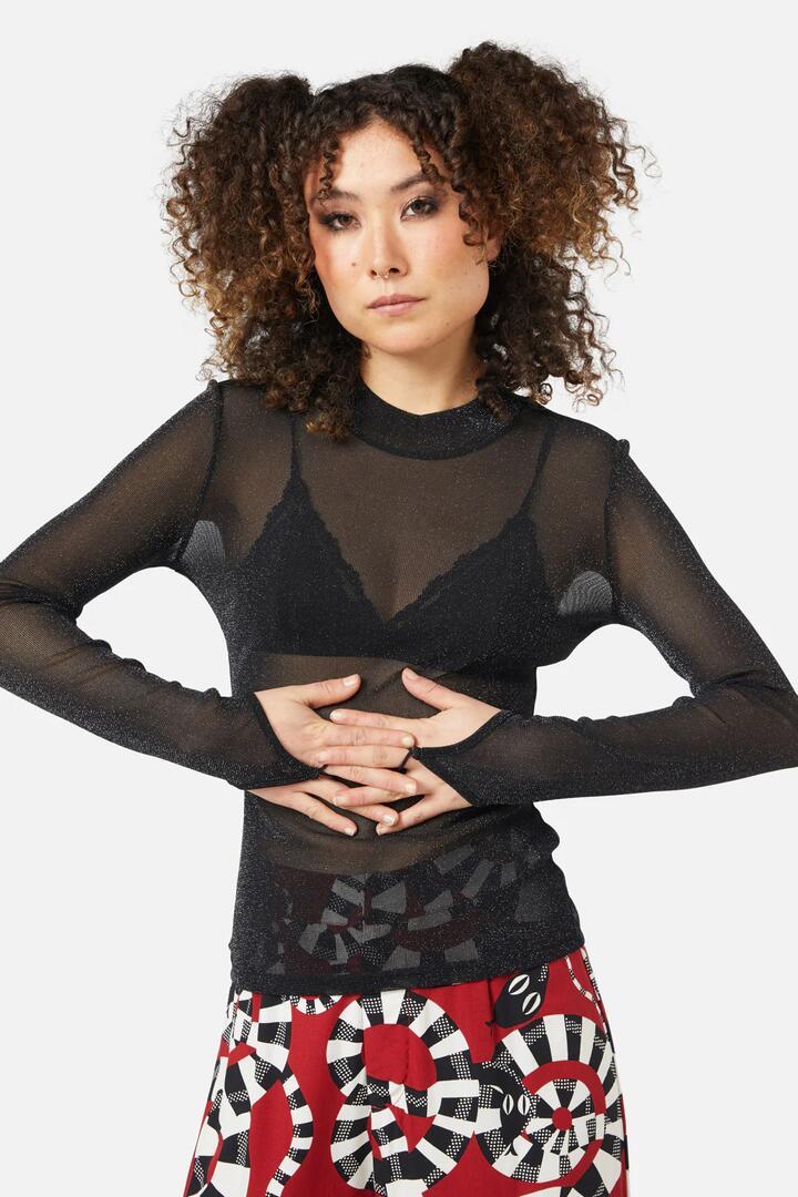Image of a model wearing Tops. Productname: Magic Top in Black colour by brand - Black Friday