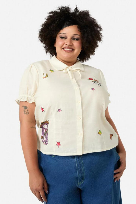 Image of a model wearing Tops. Productname: Curve Meowdy Badge Blouse in Cream colour by brand - Dangerfield
