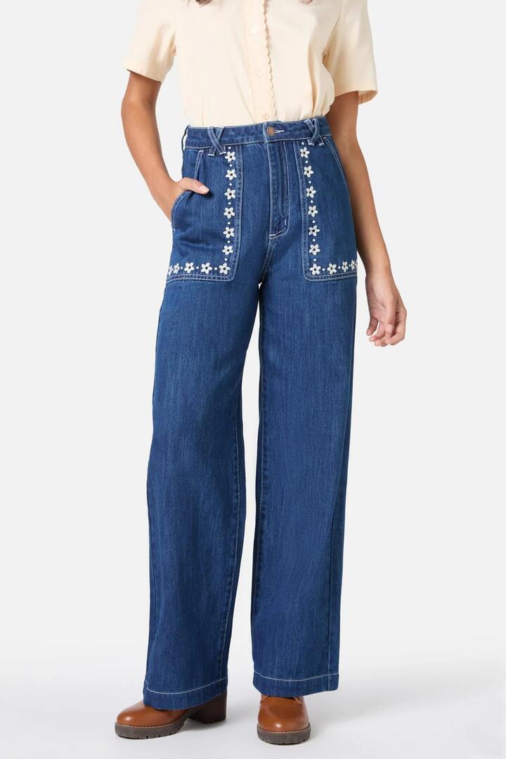 Image of a model wearing Denim. Productname: Meg Daisy Embroidered Jean in Blue Denim colour by brand - Princess Highway