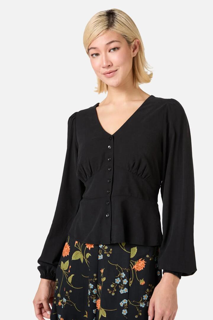 Image of a model wearing Tops. Productname: Grace Long Sleeve Top in Black colour by brand - Princess Highway
