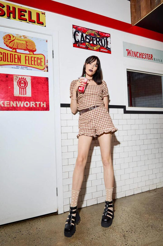 Image of a model wearing Shorts. Productname: Saloon Gingham Shorts in Cream/Brown colour by brand - Black Friday