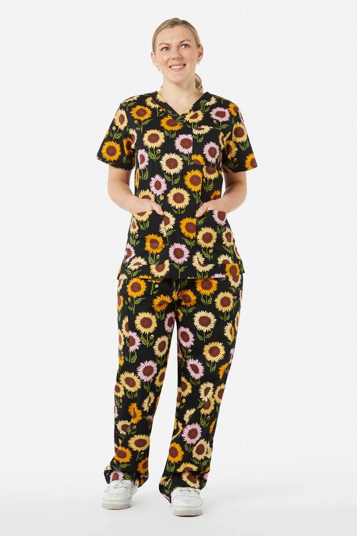 Image of a model wearing Uniforms & Workwear. Productname: Sunflower Scrub Set in Black colour by brand - Princess Highway
