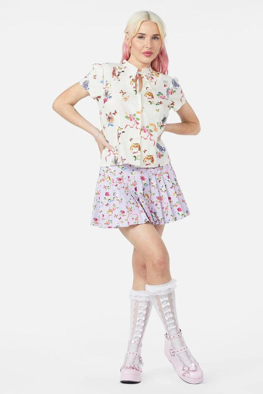 Image of a model wearing Tops. Productname: Kitsch Kitty Print Blouse in Cream colour by brand - Dangerfield