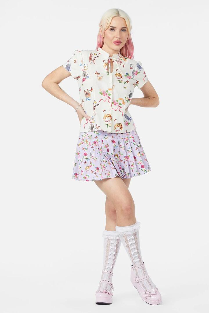 Image of a model wearing Tops. Productname: Kitsch Kitty Print Blouse in Cream colour by brand - Dangerfield