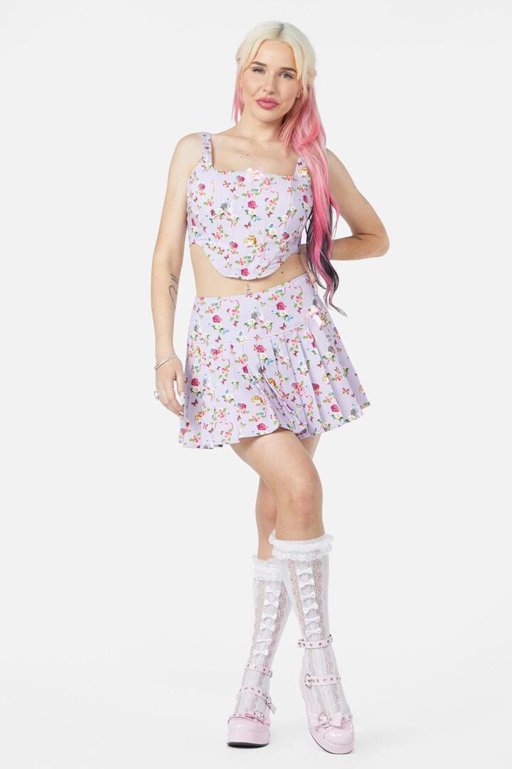 Image of a model wearing Skirts. Productname: Kitsch Kitty Print Skort in Purple colour by brand - Dangerfield