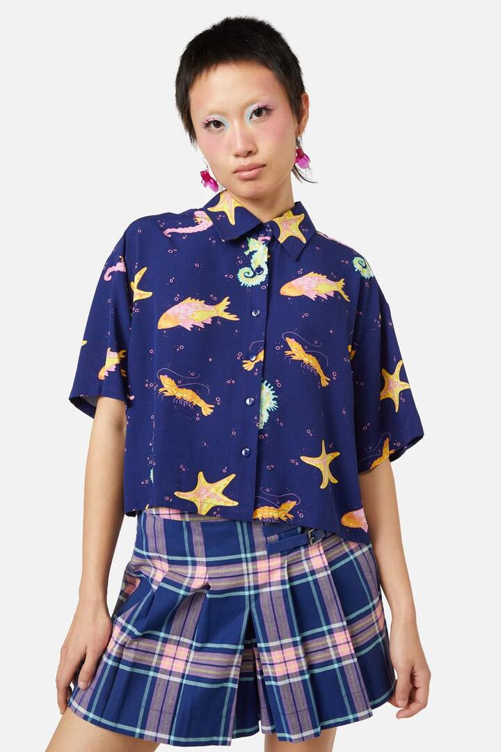 Image of a model wearing Tops. Productname: Riptide Blouse in Navy colour by brand - Dangerfield