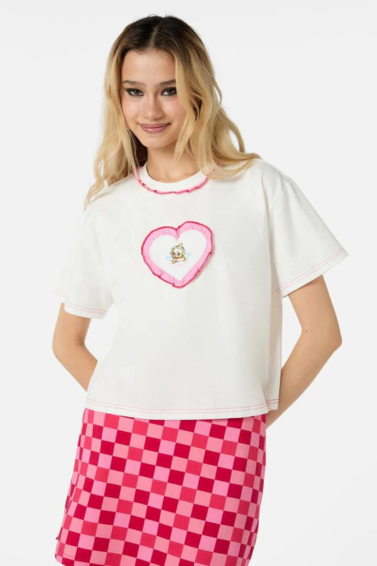 Image of a model wearing Tops. Productname: Cupid Crop OS Tee in White colour by brand - Dangerfield