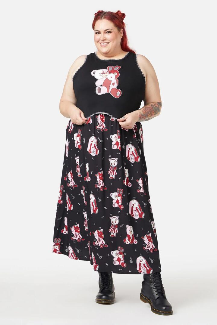 Image of a model wearing Tops. Product name - Buttons Tank in Black colour by brand - Black Friday