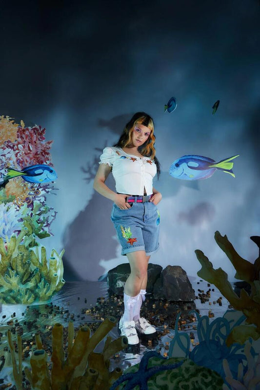 Image of a model wearing Tops. Productname: Fish Are Friends Top in Cream colour by brand - Dangerfield