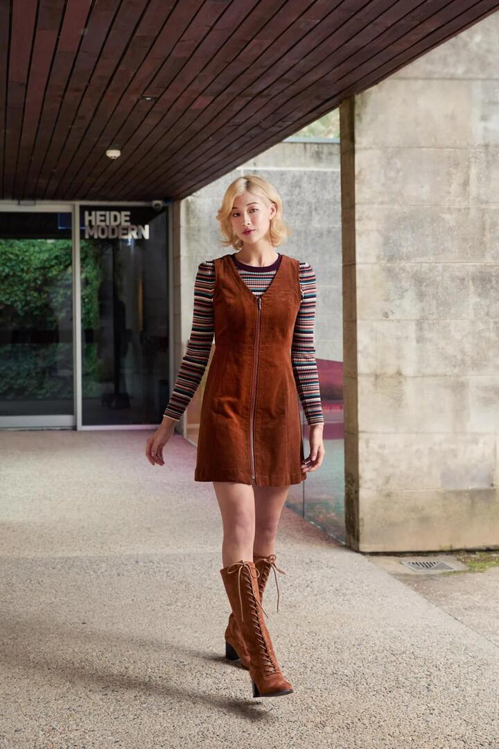Image of a model wearing Dress. Productname: Honey Cord Pinafore in Wine colour by brand - Princess Highway