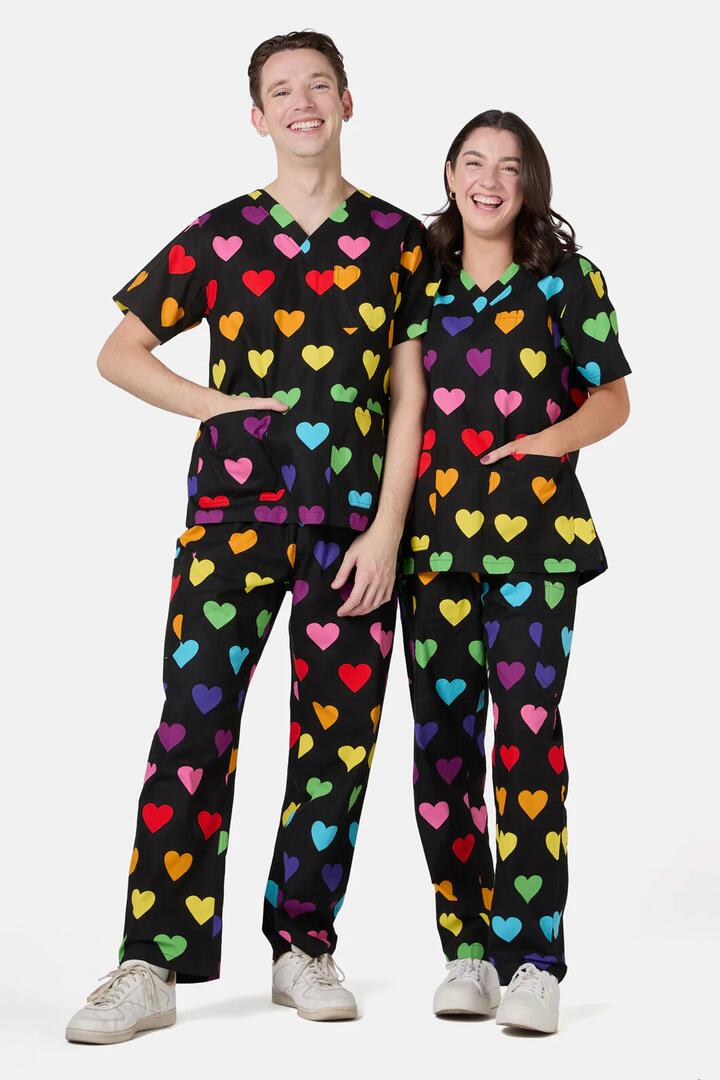 Image of a model wearing Uniforms & Workwear. Productname: Rainbow Hearts Scrub Set in Black colour by brand - Dangerfield