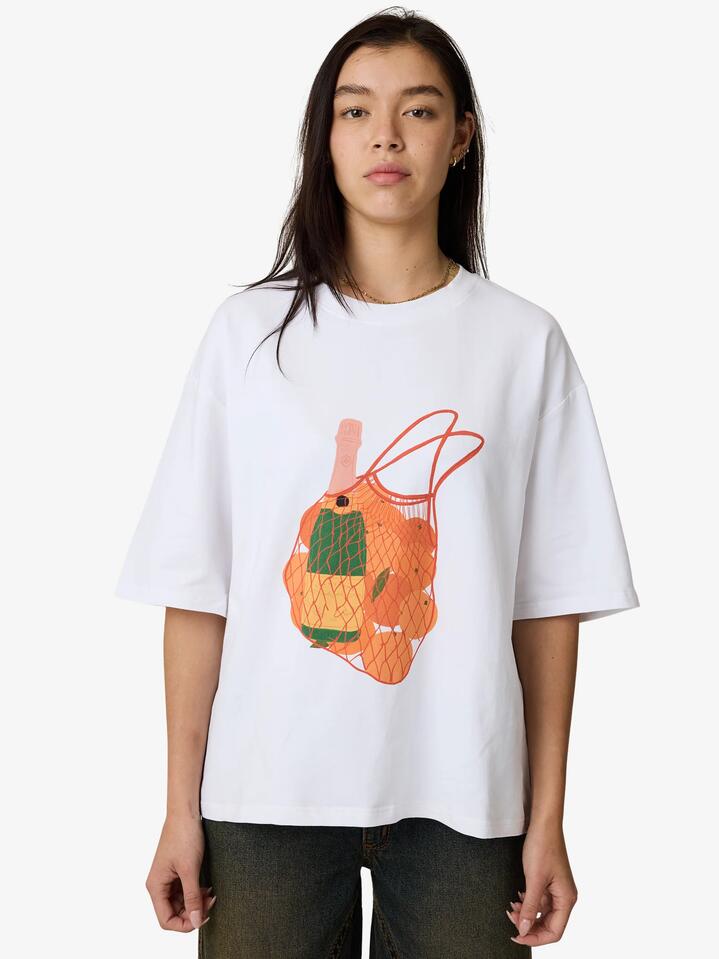 Image of a model wearing Tops. Productname: SNDYS Mai Tai T-Shirt in Orange colour by brand - SNDYS