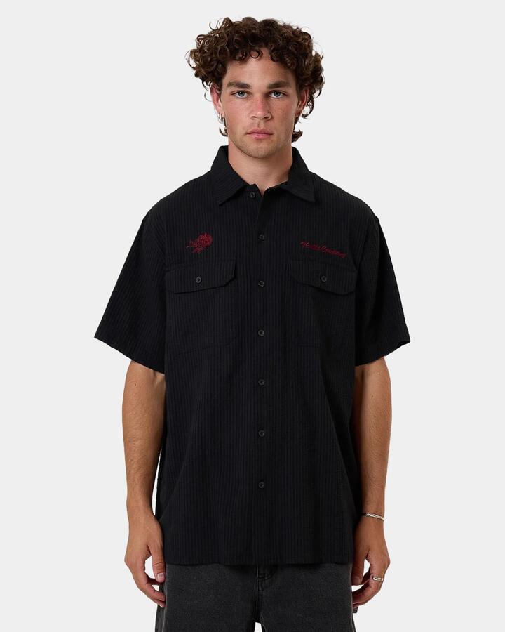 Image of a model wearing Tops. Product name - Thrills Mens Appreciation Short Sleeve Shirt Black in Black colour by brand - Thrills