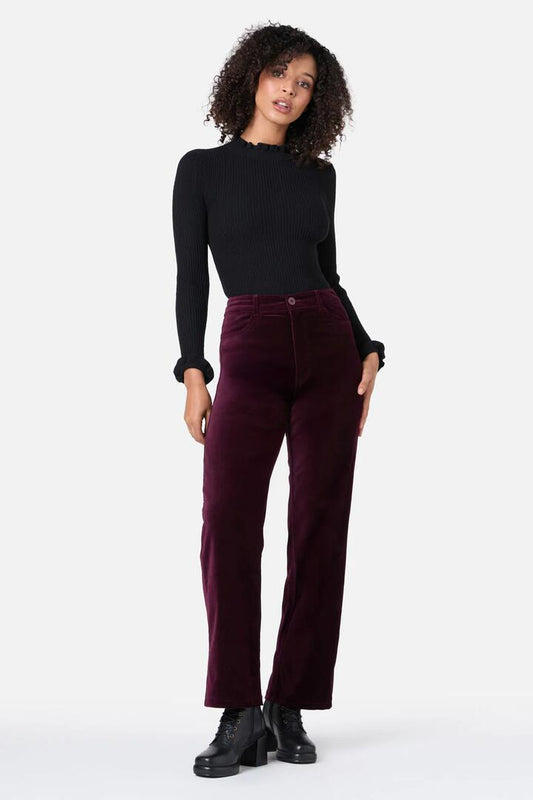 Image of a model wearing Denim. Productname: Stella Velvet Jean in Wine colour by brand - Princess Highway