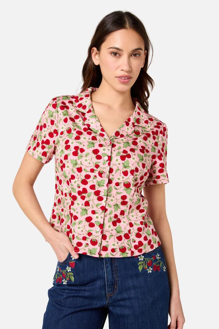 Image of a model wearing Shorts. Productname: Raspberry Short Sleeve Blouse in Pink colour by brand - Princess Highway