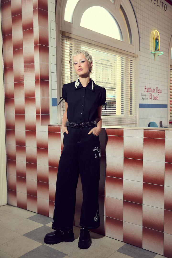 Image of a model wearing Pants. Productname: Catkins Emb Pants in Black colour by brand - Dangerfield