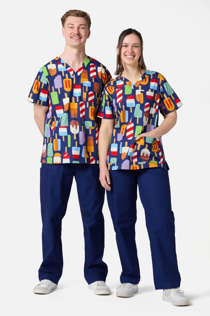 Image of a model wearing Pants. Productname: Summer Treats Top & Pant Scrub Set in Navy colour by brand - Scrubs With Love