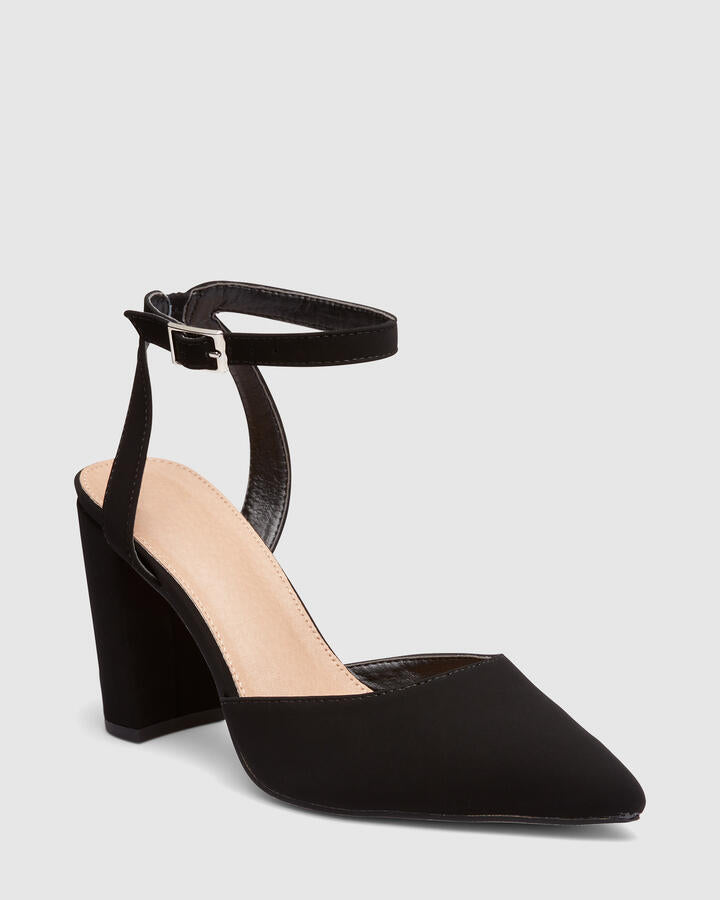 Image of a model wearing Pants. Product name - Ivie Black Pumps in Black colour by brand - Novo