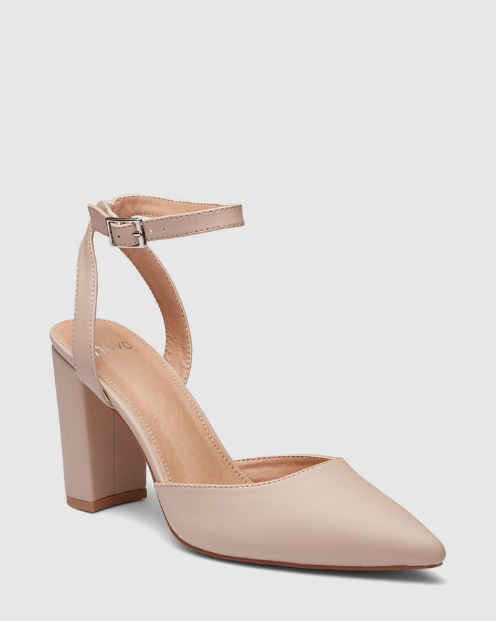 Image of a model wearing Pants. Product name - Ivie Nude Pumps in Neutral colour by brand - Novo