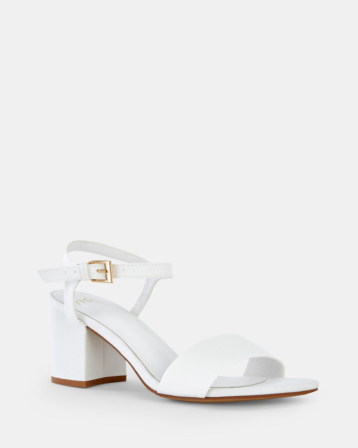 Image of Heels. Product name - Udacious White Low Heels in Multi colour by brand - Novo