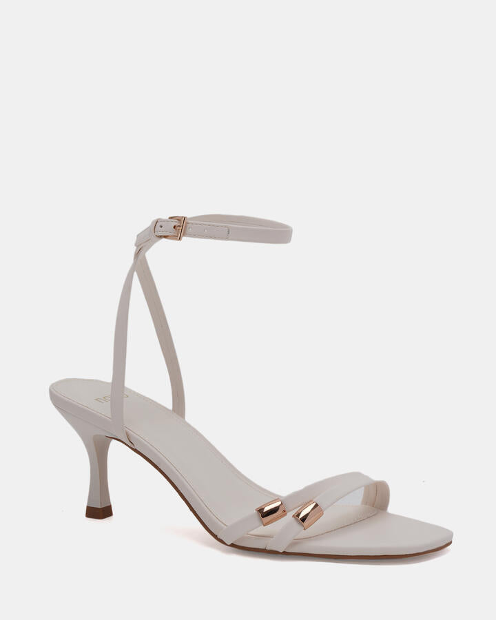 Image of Heels. Product name - Verone White Low Heels in Multi colour by brand - Novo