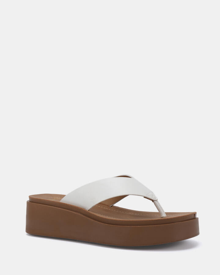 Image of Sandals. Product name - Berri White Wedge Sandals in Multi colour by brand - Novo