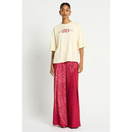 Image of a model wearing Tops. Productname: Ryder Logo Tee in ELDAWEISS/GOGI BERRY colour by brand - sass and bide