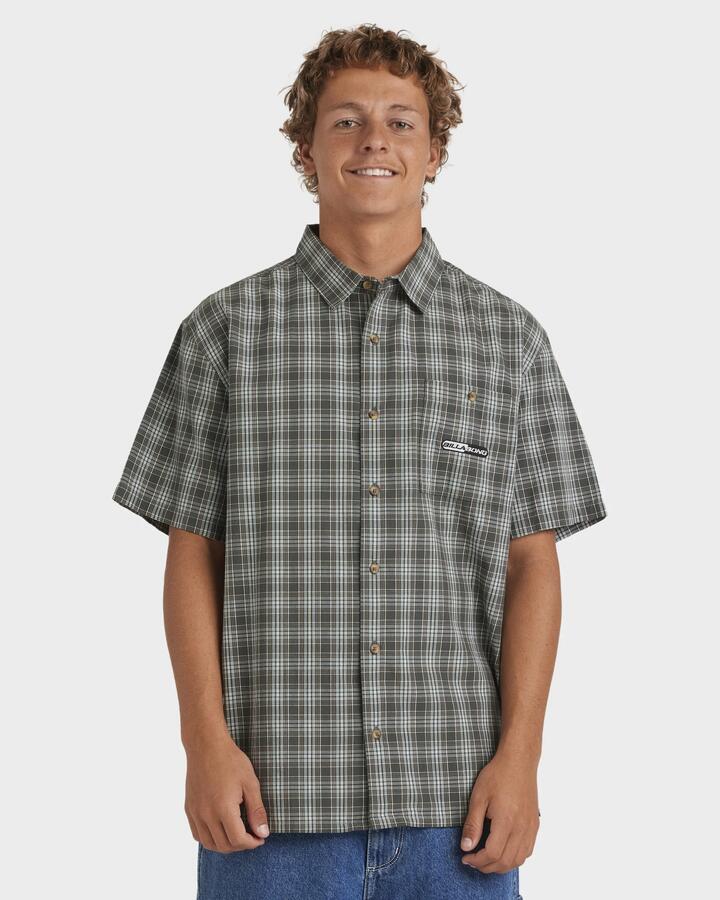 Image of a model wearing Tops. Productname: Billabong Mens Spec Mogul Short Sleeve Shirt Dark Forest - in Dark Forest colour by brand - Billabong