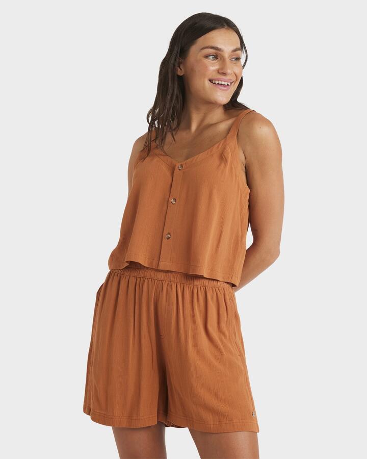 Image of a model wearing Shorts. Product name - Roxy Womens Sol Vibes Elastic Waist Shorts Camel in Camel colour by brand - Roxy