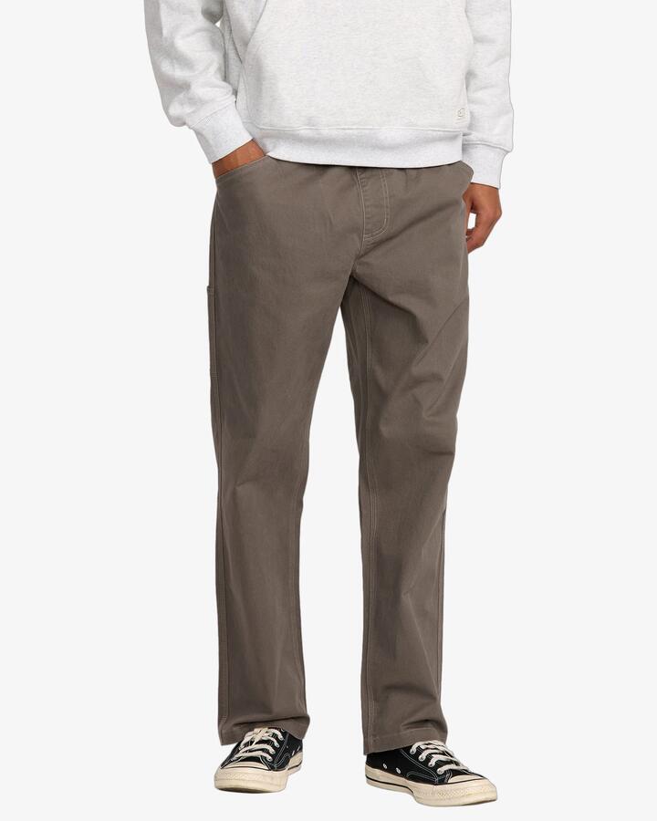 Image of a model wearing Pants. Product name - RVCA Mens Americana Carpenter Pants Mushroom in Mushroom colour by brand - RVCA
