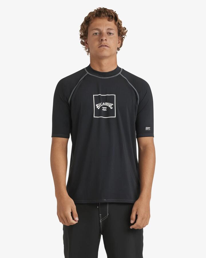 Image of a model wearing Tops. Product name - Billabong Mens Boxed Arch Short Sleeve Rash Vest Black in Black colour by brand - Billabong
