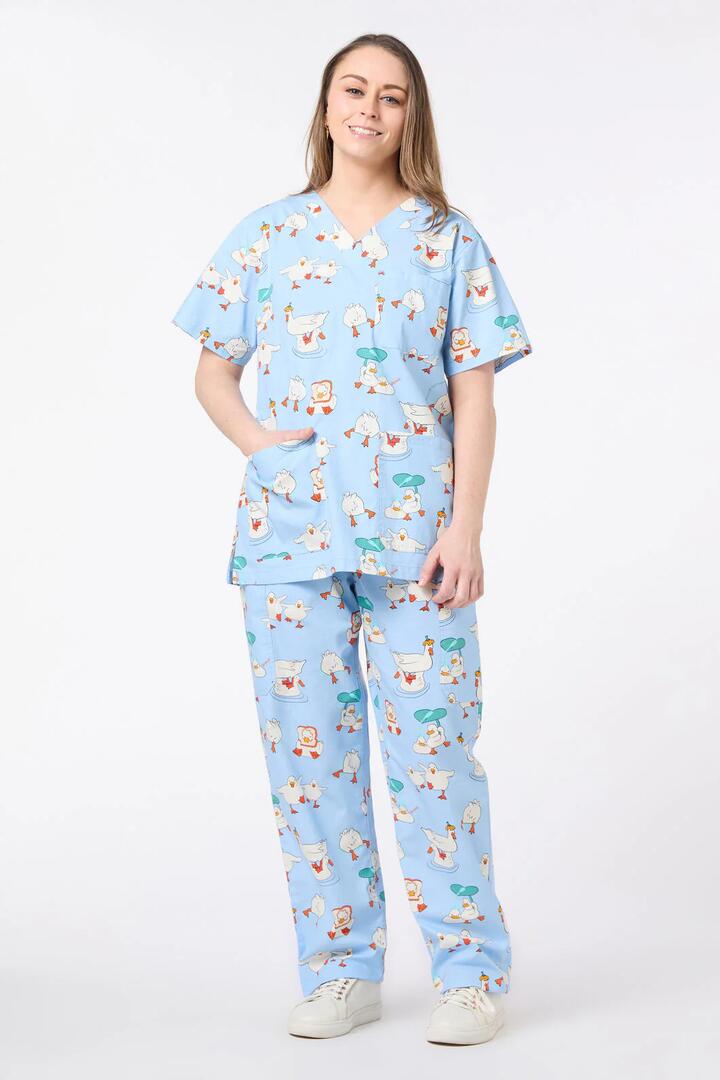 Image of a model wearing Uniforms & Workwear. Productname: Puddle Duck Scrub Set in Blue colour by brand - Scrubs With Love