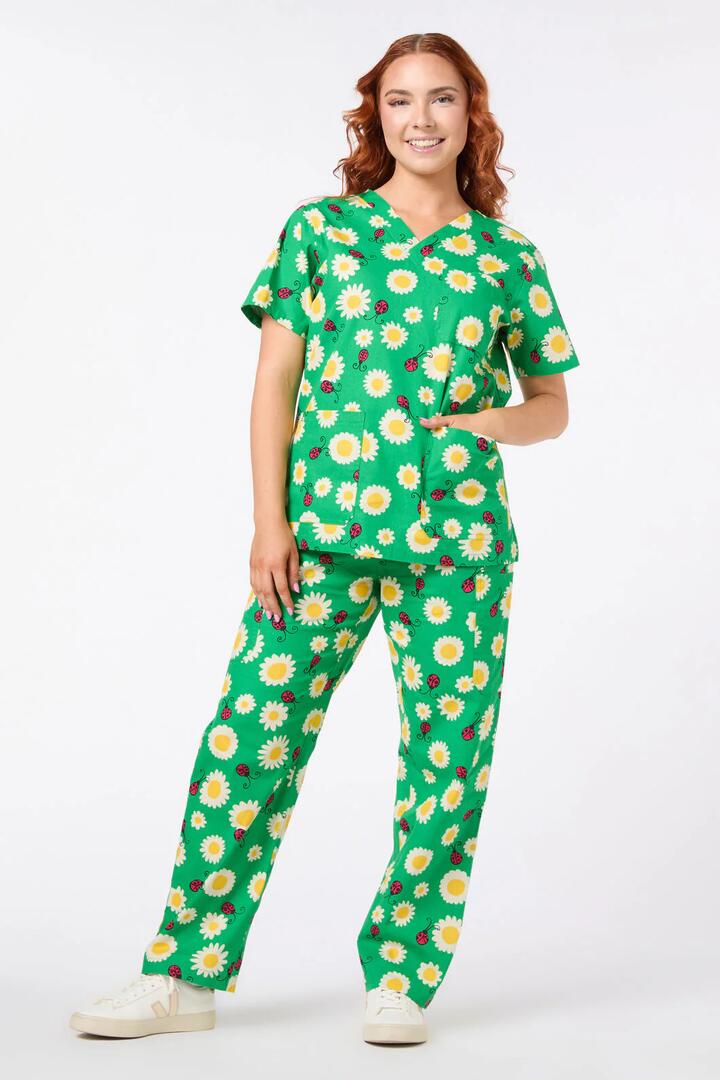 Image of a model wearing Uniforms & Workwear. Productname: Daisy Ladybird Scrub Set in Green colour by brand - Scrubs With Love