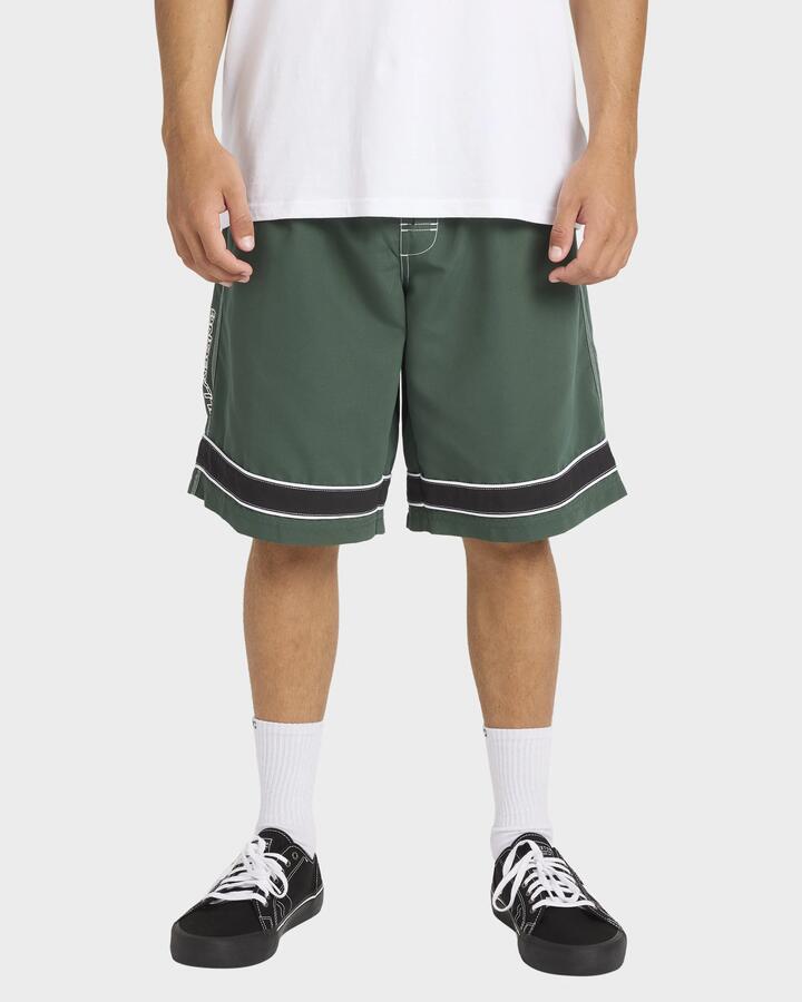 Image of a model wearing Shorts. Product name - Billabong Mens Throw Ons 2.0 21" Swim Shorts Forest in Forest colour by brand - Billabong