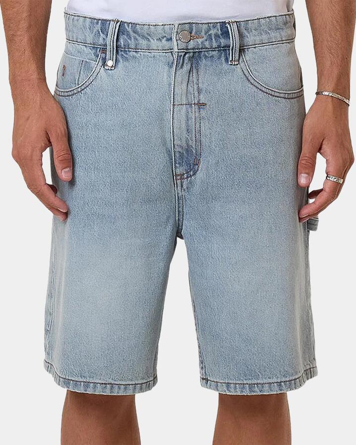 Image of a model wearing Shorts. Productname: thrills - Mens Slacker Denim Shorts - Blue - in Blue colour by brand - thrills