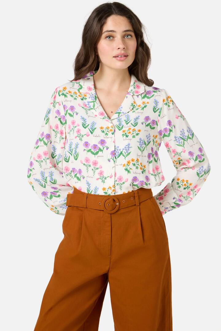 Image of a model wearing Tops. Productname: Cottage Garden Blouse in Cream colour by brand - Princess Highway