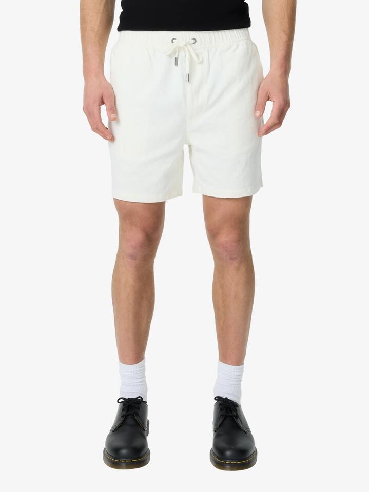 Image of a model wearing Shorts. Productname: Article One Luigi Linen Short in Off White colour by brand - Article One
