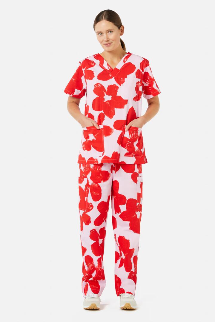 Image of a model wearing Uniforms & Workwear. Product name - Poppy Scrub Set in Print colour by brand - Gorman