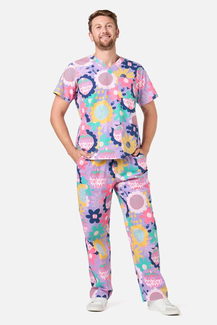 Image of a model wearing Uniforms & Workwear. Product name - Daisy Sketch Scrub Set in Multi colour by brand - Gorman