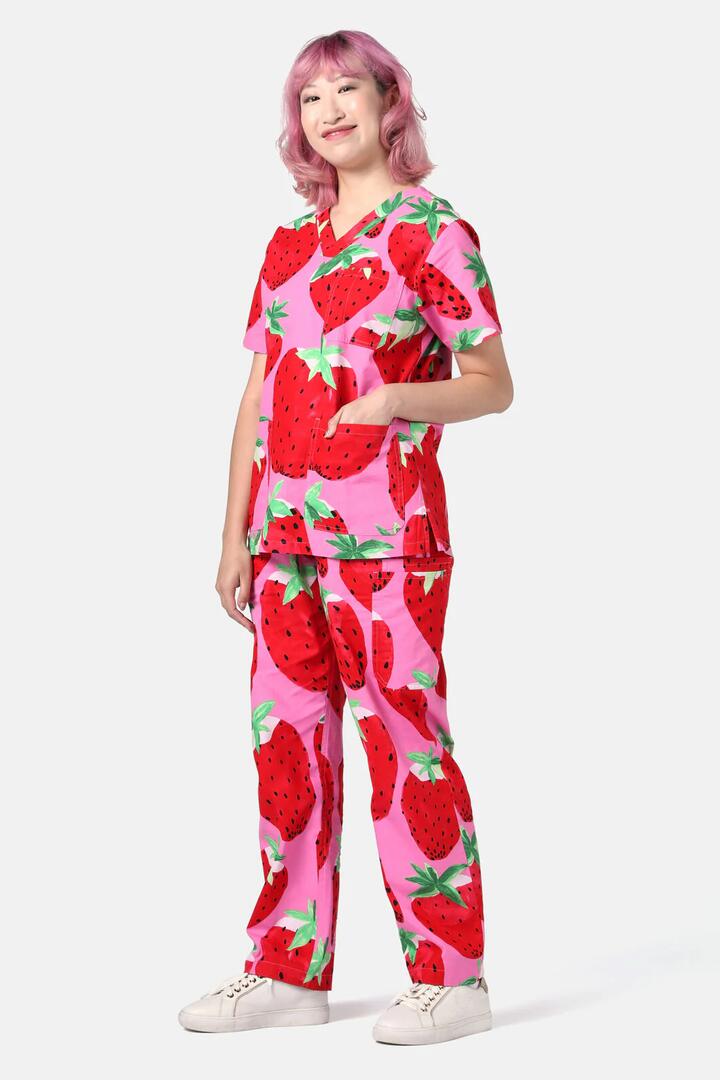 Image of a model wearing Uniforms & Workwear. Product name - Strawberry Fields Scrub Set in Pink colour by brand - Gorman