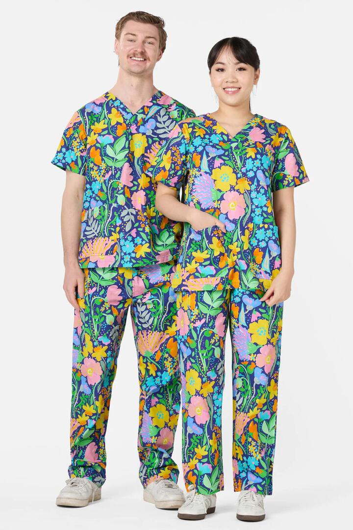 Image of a model wearing Uniforms & Workwear. Product name - Flora Scrub Set in Multi colour by brand - Gorman